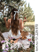 Picnic Woman Strawberries: Sunny day, woman enjoys picnic with strawberries and coffee in a serene meadow. Стоковое фото, фотограф svetograph / Фотобанк Лори