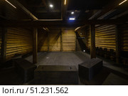 Yuryevets, Ivanovo region, Russia, July 24, 2025: Interior old wooden merchant's storehouse of Katyushin estate from 19th century, now modern exhibition space. Редакционное фото, фотограф Алексей Антипов / Фотобанк Лори