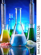 Glass Flasks Filled With Colorful Liquids and Solids in a Laboratory Setting. Generative AI. Стоковое AI-изображение, AI-художник Roman Zavorotny / Фотобанк Лори