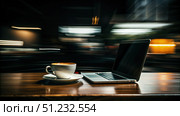 A Laptop, Coffee, and Blurry City Lights at a Late Night Cafe. Generative AI. Стоковое AI-изображение, AI-художник Roman Zavorotny / Фотобанк Лори