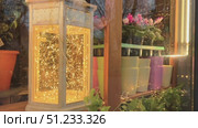 A Beautiful Decorative Lantern adorned with Twinkling Lights that create a magical atmosphere. Стоковое видео, видеограф Olesia Kondrateva / Фотобанк Лори