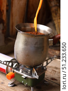 Enjoying Brewed Coffee on a Camping Stove During an Outdoor Adventure. Стоковое фото, фотограф Igor Bastrakov / Фотобанк Лори