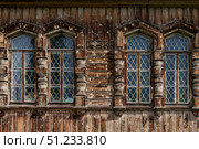 Wooden windows with metal bars in old wooden house. Стоковое фото, фотограф Екатерина Якименко / Фотобанк Лори