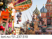 MOSCOW, RUSSIA - January 9, 2025: Christmas decorations and chain carousels on Red Square. Christmas decorations on the streets of Moscow. Редакционное фото, фотограф Photojuli / Фотобанк Лори