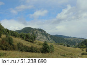 A Beautiful Scenic Mountain Landscape Beneath a Cloudy Sky Above. Стоковое фото, фотограф Igor Bastrakov / Фотобанк Лори
