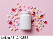 Vitamin and health supplement white blank bottle with colorful pills flying out on a pink background. Flat lay, top view. Space for text. Bottle of various types multivitamins and tablets composition. Стоковое AI-изображение, AI-художник Марина Демидюк / Фотобанк Лори