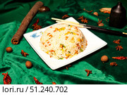 Savoury Stir-Fry Rice on White Plate Beside Cinnamon Bark and Star Anise. Стоковое фото, фотограф Aleksandr Golubev / Фотобанк Лори