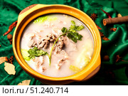 Delicious Savory Mutton Stew Presented in a Traditional Chinese Serving Pot. Стоковое фото, фотограф Aleksandr Golubev / Фотобанк Лори
