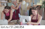 Seamstress staff sew, assistant work with mannequin, designer draw dress pattern on paper. Стоковое видео, видеограф Яков Филимонов / Фотобанк Лори