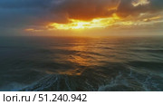 Aerial view on big waves and dramatic sunset sky. Стоковое видео, видеограф Михаил Коханчиков / Фотобанк Лори