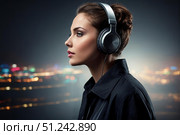 Девушка в современных наушниках слушает музыку, аудиокнигу. Стоковое AI-изображение, AI-художник Руслан Лесков / Фотобанк Лори