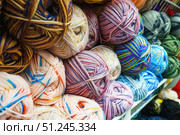 View of various color tangles of wool yarn for knitting, selective focus. Стоковое фото, фотограф Зарифа Арсланова / Фотобанк Лори