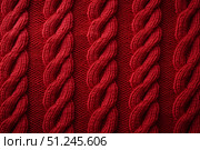 Red knitted winter sweater Background, red texture. Стоковое AI-изображение, AI-художник Irina Kuchugurina/Gaudy / Фотобанк Лори