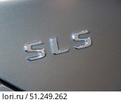 Close-up of Silver Mercedes-Benz SLS Logo (2024 год). Редакционное фото, фотограф Sergakoff / Фотобанк Лори