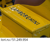 Lamborghini Yellow Engine Cover at Automotive Show. Редакционное фото, фотограф Sergakoff / Фотобанк Лори