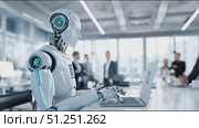 Futuristic humanoid robot with sleek design is working on a laptop in a modern office environment, showcasing advanced technology and collaboration among professionals. Стоковое AI-видео, аниматор Ирина Ручушкина / Фотобанк Лори