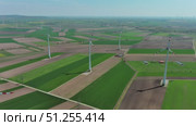 Wind turbines and agriculture fields. Стоковое видео, видеограф Михаил Коханчиков / Фотобанк Лори