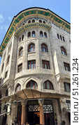 Galata Tower in Istanbul, view from the narrow street Narrow street with Galata Tower and historic building in Beyoglu district, Istanbul, Turkey Beautiful view of city street with different stores. Редакционное фото, фотограф Zita Khasanova / Фотобанк Лори