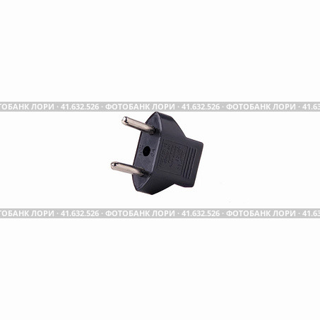 2-pin EU to US plug type Converter black Plastic element isolated on a white background. Close up. Стоковое фото, фотограф Воловодов Владимир / Фотобанк Лори