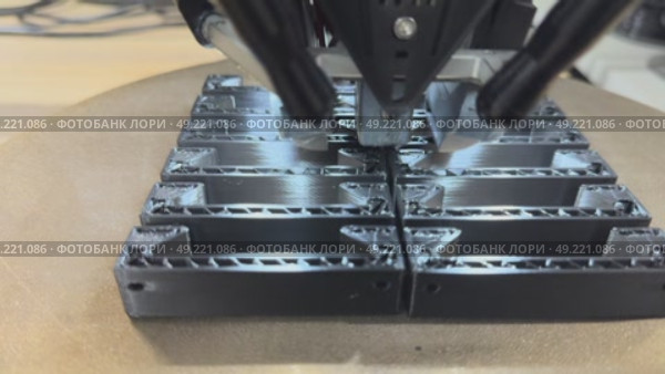 3 d printer makes prints parts from black plastic material,3D printer in operation close-up. Automatic three dimensional 3d printing performs plastic modeling in laboratory. The 4ht industrial. Стоковое видео, видеограф Куликов Константин / Фотобанк Лори