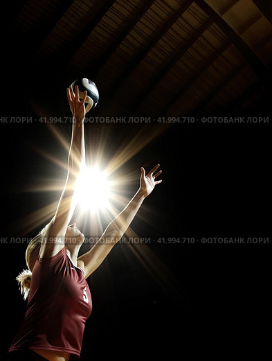 A blonde girl in a jump takes a ball from a pitch on a dark background. Close-up. The concept of gaming sports. Стоковое AI-изображение, AI-художник Ярославский Максим / Фотобанк Лори
