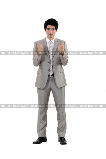 A businessman in a fighting stance. Стоковое фото, агентство Ingram Publishing / Фотобанк Лори