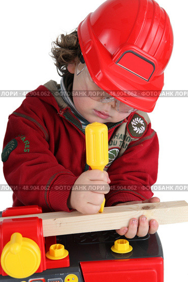 A child pretending to be a tradesperon. Стоковое фото, агентство Ingram Publishing / Фотобанк Лори