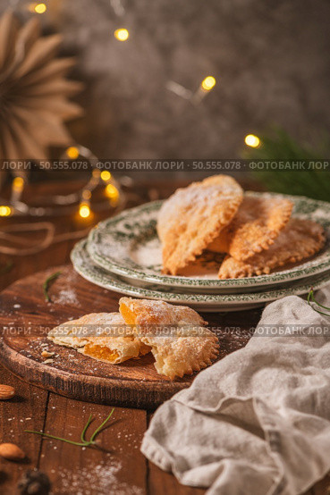 A crescent-shaped pastry whose filling is made of eggs and almonds wrapped in crispy dough, cut in an artisanal way and sprinkled with sugar. Стоковое фото, агентство Ingram Publishing / Фотобанк Лори