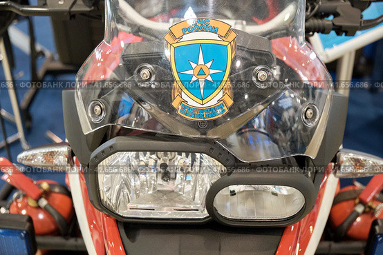 A fire-fighting motorcycle at the stand of the Russian emergencies Ministry at exhibition Interpolitex. Helping people in emergencies and fires - Moscow, Russia, 10 25 2019. Редакционное фото, фотограф Андрей Журавлев / Фотобанк Лори