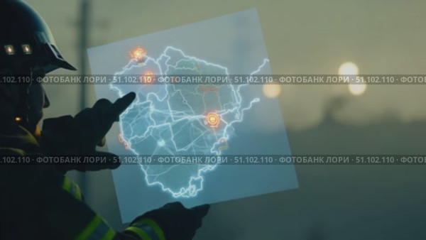 A firefighter examines a digital map, focusing on critical areas during a wildfire incident in California. Стоковое AI-видео, аниматор Данила Большаков / Фотобанк Лори