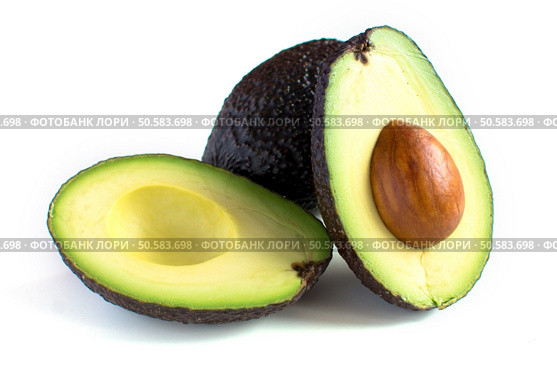 A fresh avocado cut in half. Стоковое фото, агентство Ingram Publishing / Фотобанк Лори
