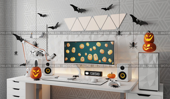 A general view of a gamer's home workplace with a computer and a gamepad decorated with decorations for the Halloween holiday. Стоковая иллюстрация, иллюстратор Енваев Андрей / Фотобанк Лори
