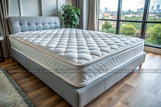 A healthy back. Choosing a mattress. A new white luxurious comfortable orthopedic mattress on the bed in the bright bedroom. Стоковое AI-изображение, AI-художник Photojuli / Фотобанк Лори