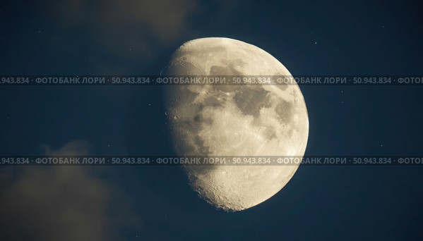 A large, full moon is shining brightly in the night sky. Стоковое AI-изображение, AI-художник Ярославский Максим / Фотобанк Лори