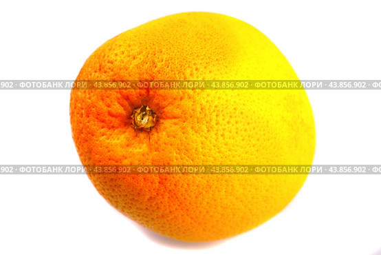 A large whole grapefruit lies on a white background. Isolated. Стоковое фото, фотограф Ярославский Максим / Фотобанк Лори