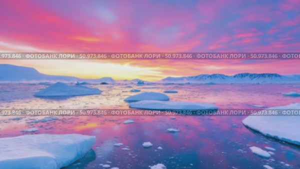 A majestic arctic panorama at sunrise, with brilliant pink and purple clouds casting colorful reflections on the calm, ice-strewn ocean. Стоковое AI-видео, аниматор Данила Большаков / Фотобанк Лори