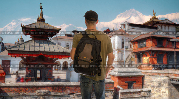A male tourist is traveling around the city of Kathmandu. Nepal. Стоковое фото, агентство Ingram Publishing / Фотобанк Лори