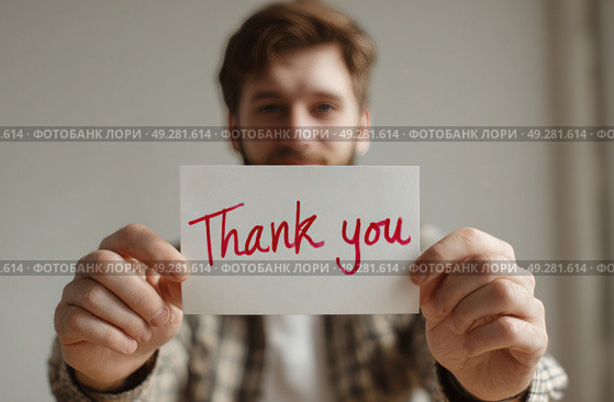 A man holding a white card that says "Thank You" in red. Стоковое AI-изображение, AI-художник Ярославский Максим / Фотобанк Лори
