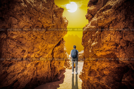 A man walks among the rocks of the Andes in the Atacama Desert. Стоковое фото, агентство Ingram Publishing / Фотобанк Лори