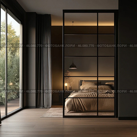 A modern minimalist bedroom with a warm, cozy atmosphere. The focal point is the large bed with soft bedding in natural shades. A stylish pendant light hangs above the bed, creating soft lighting. On the bedside table there is a lamp and a small vase with dried flowers. The room is dominated by calm, neutral colors, dark accents and a wooden floor.A huge mirror with a black metal frame reflects the bed and enhances the feeling of space. On the left are panoramic windows overlooking the greenery and the terrace, letting in natural light. Стоковое AI-изображение, AI-художник Анна Кривицкая / Фотобанк Лори