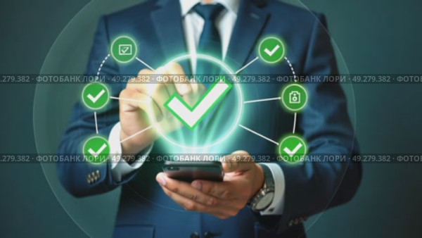 A person in a business suit working on a smartphone with virtual icons related to successful transactions, including a glowing green checkmark. Стоковое AI-видео, аниматор Sergey Grishin / Фотобанк Лори