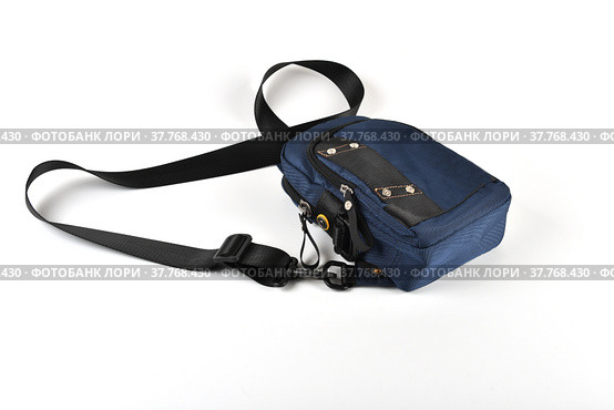 A small shoulder bag for documents and small items on a white background. A must have accessory for travel. Стоковое фото, фотограф Андрей Никитин / Фотобанк Лори