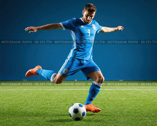 A soccer player in a blue jersey kicks a soccer ball. Стоковое AI-изображение, AI-художник Ярославский Максим / Фотобанк Лори
