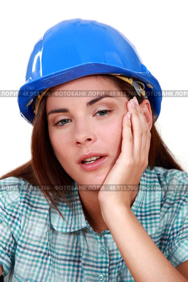 A tired-looking tradeswoman. Стоковое фото, агентство Ingram Publishing / Фотобанк Лори