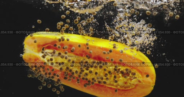 A Vibrant Slice of Papaya Presented on a Black Background, Exuding Freshness and Colorful Delight. Стоковое видео, видеограф Владимир Ковальчук / Фотобанк Лори