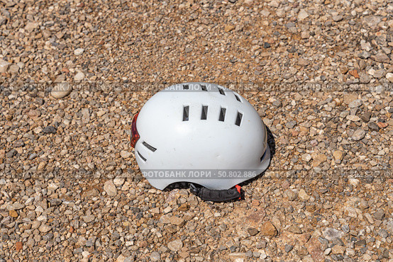 A white helmet on the orange and yellow stones background. Стоковое фото, фотограф Татьяна Куклина / Фотобанк Лори