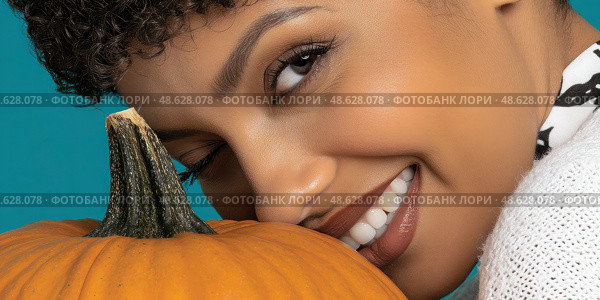 A woman is holding a pumpkin and smiling. Стоковое AI-изображение, AI-художник Ярославский Максим / Фотобанк Лори