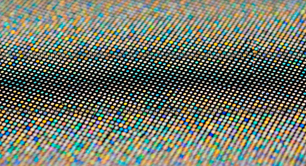 Abstract background of screen pixels with holographic effect closeup, technology texture showing digital display matrix and colorful shiny dots for modern wallpaper. Стоковое AI-изображение, AI-художник Павел Муравьев / Фотобанк Лори