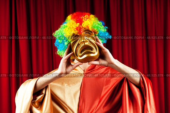 Actor with maks in a funny theater concept. Стоковое фото, агентство Ingram Publishing / Фотобанк Лори