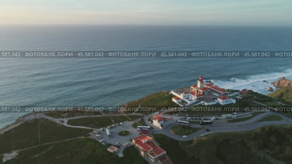 Aerial around view of lighthouse at Cape Roca (2019 год). Стоковое видео, видеограф Михаил Коханчиков / Фотобанк Лори